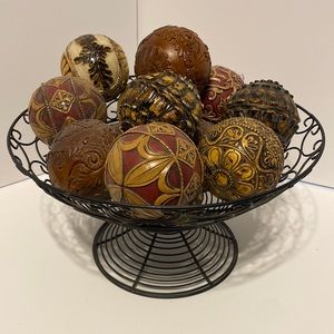 13 decor balls with black wire basket in excellent condition.